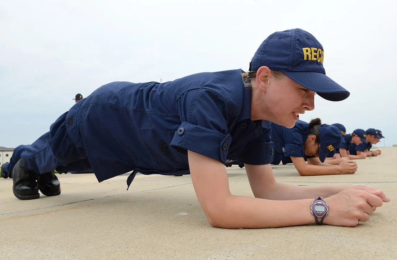 Recruits holding a timed plank during a short ab training session