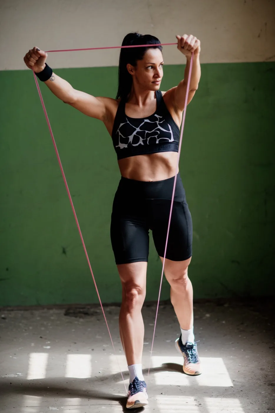 Standing core exercise with a resistance band, ribs down and torso braced